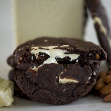 A Cookie that Cookie Lovers can feel good about. - A decadent fudgy cookie oozing with chunks of melted Belgian white chocolate chunks, & covered with whole almonds.
